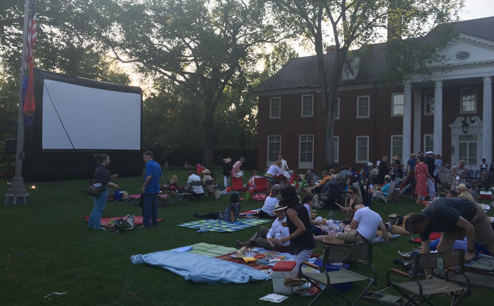 Hillwood's mansion is the backdrop for revelers picnicking on the Lunar Lawn before an outdoor film